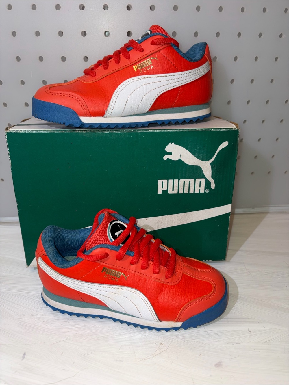 Puma Kids Roma Orange and White Low-Top Sneakers with Blue Accents